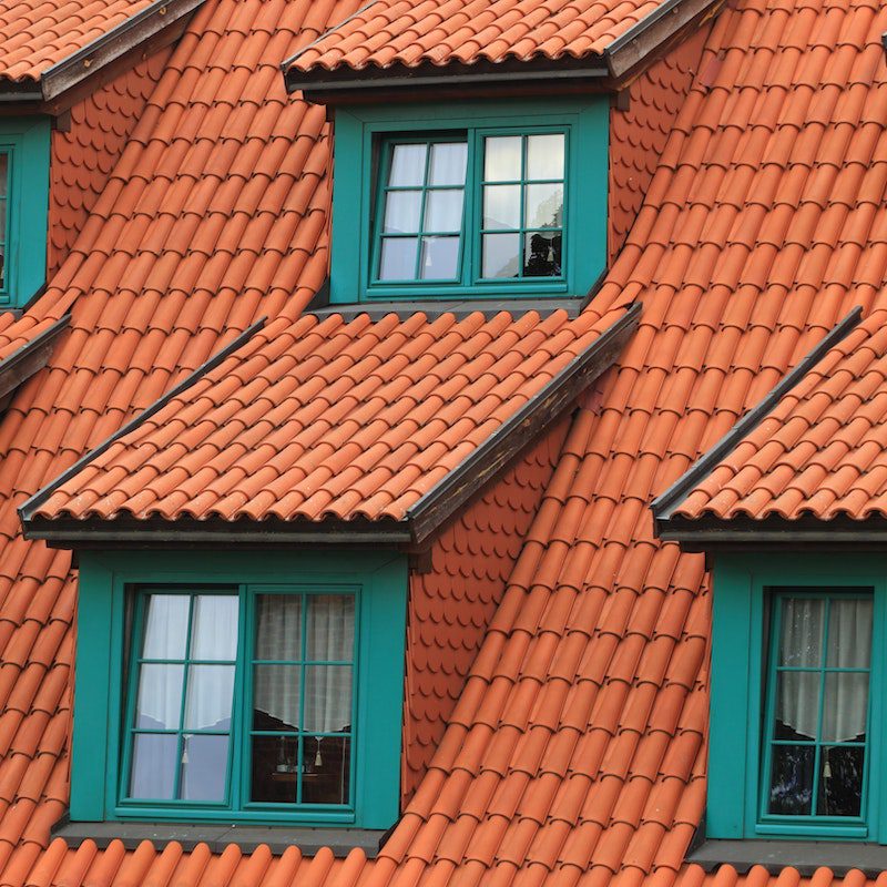 Orange Shingles on Green House